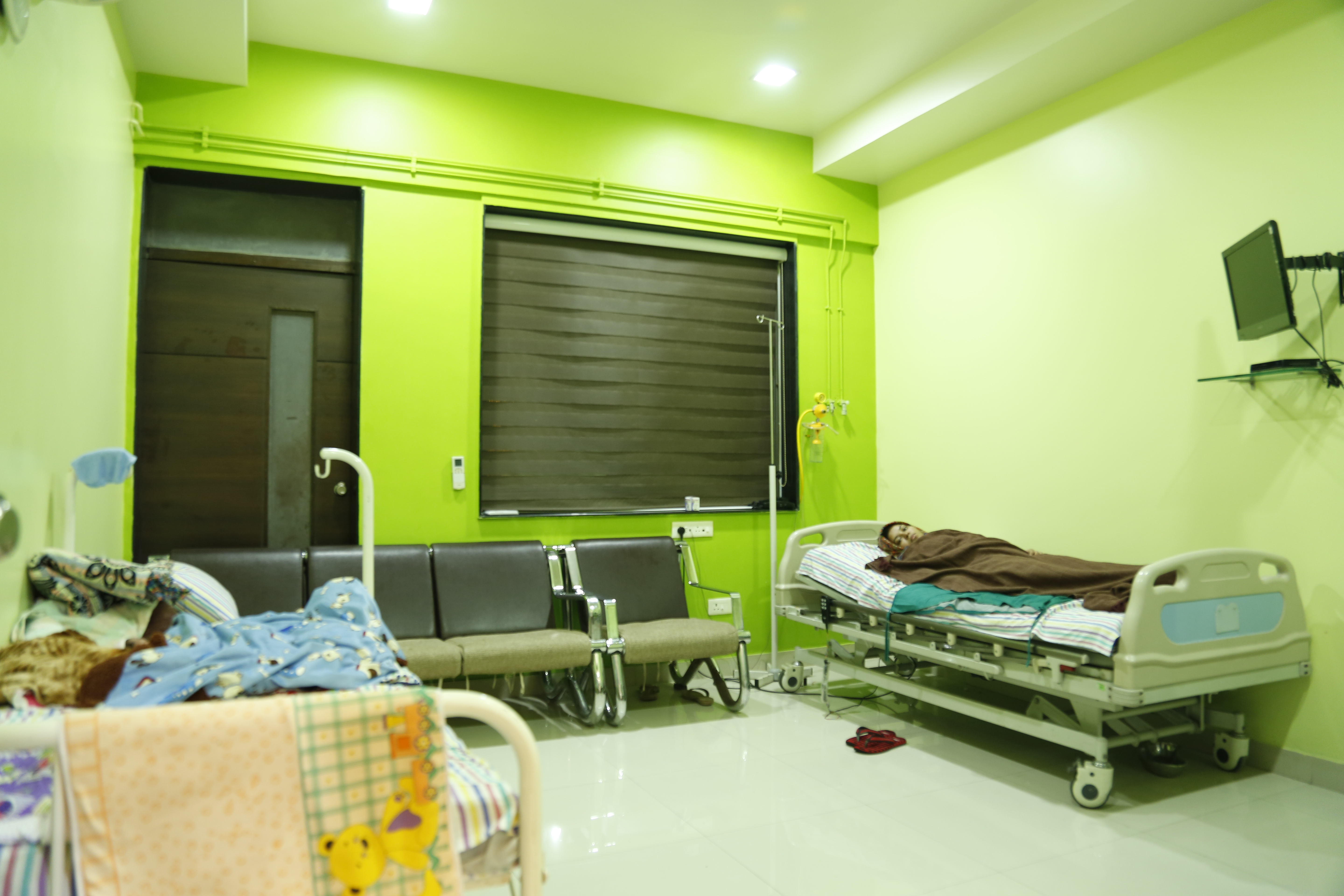 Patient room interior with comfortable bedding